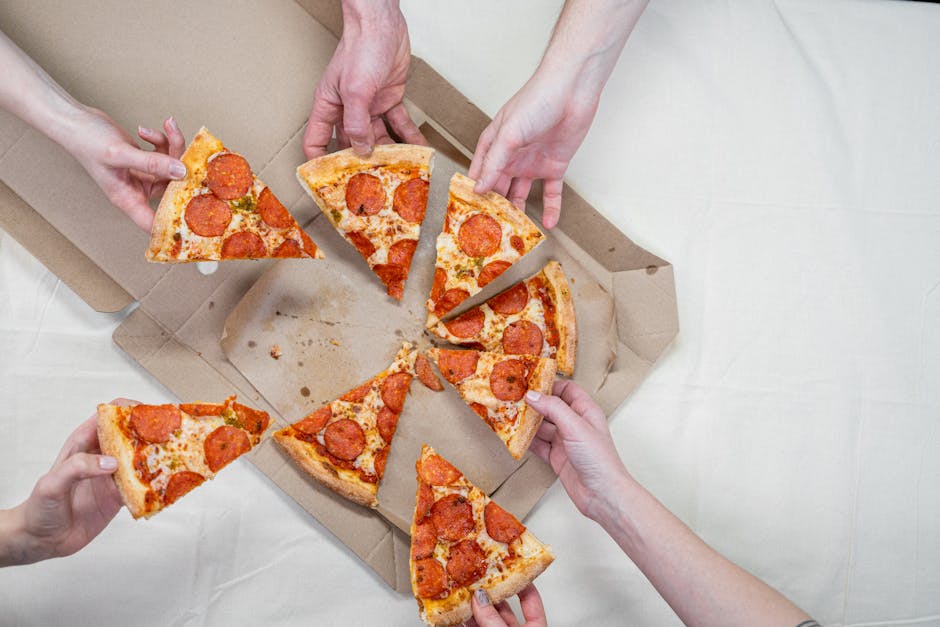Friends sharing a delicious pepperoni pizza, creating a warm and inviting atmosphere.